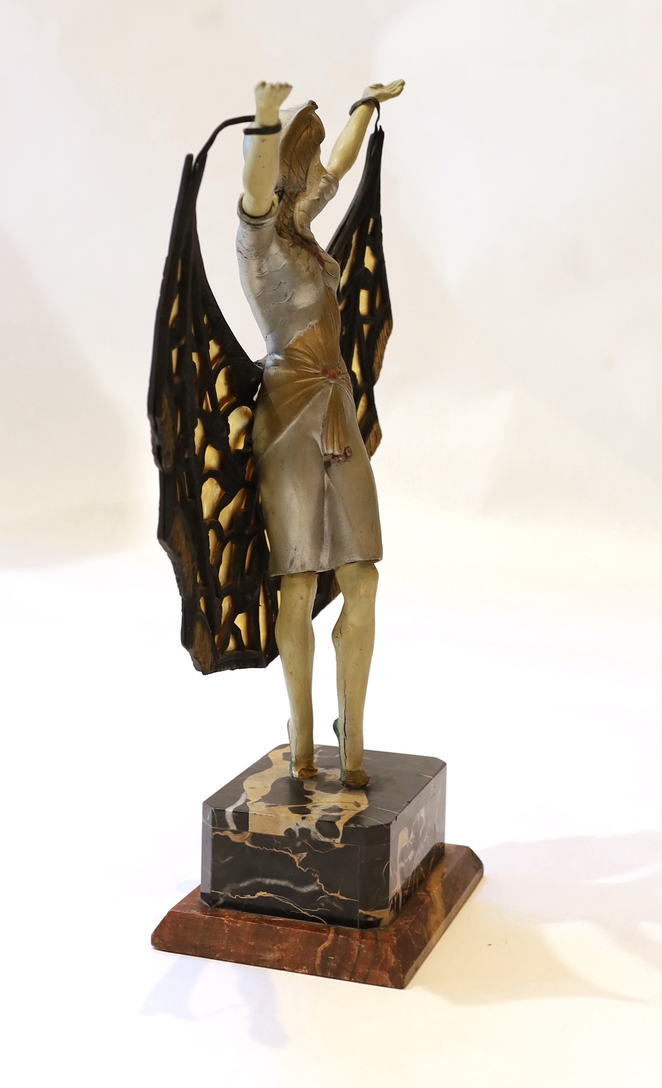 A 1920s French composition and metal butterfly dancer table lamp, on marble plinth, height 42cm